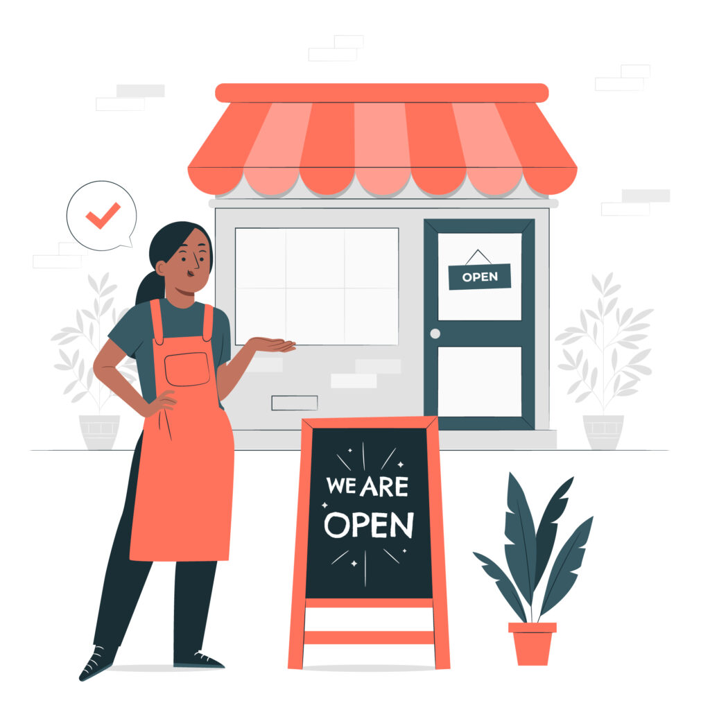 Small Business: A shop owner stands in front of their store, showcasing a "We Are Open" sign, ready to greet and serve customers.